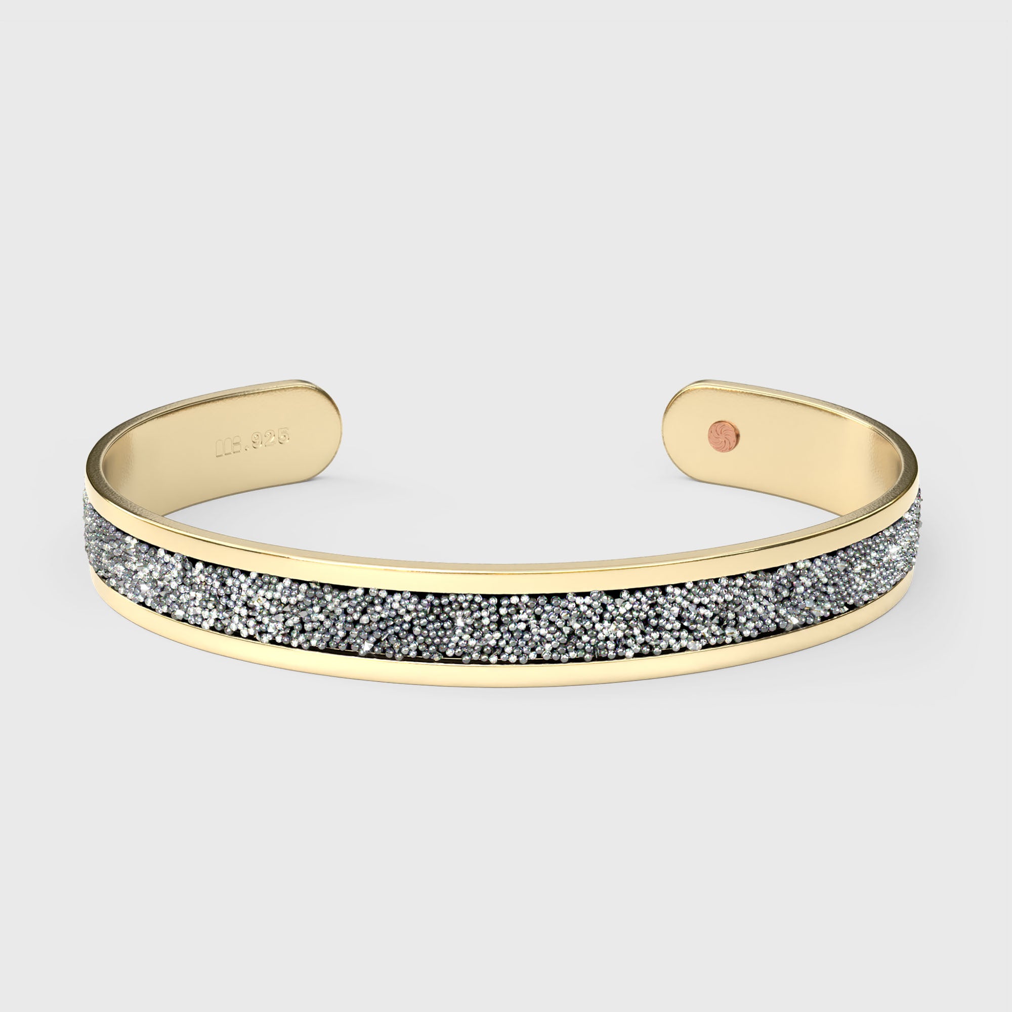 Close-up of SWAROVSKI® Chrome crystal fabric inlay on gold cuff, showing mirrored shimmer and fine-cut detail.