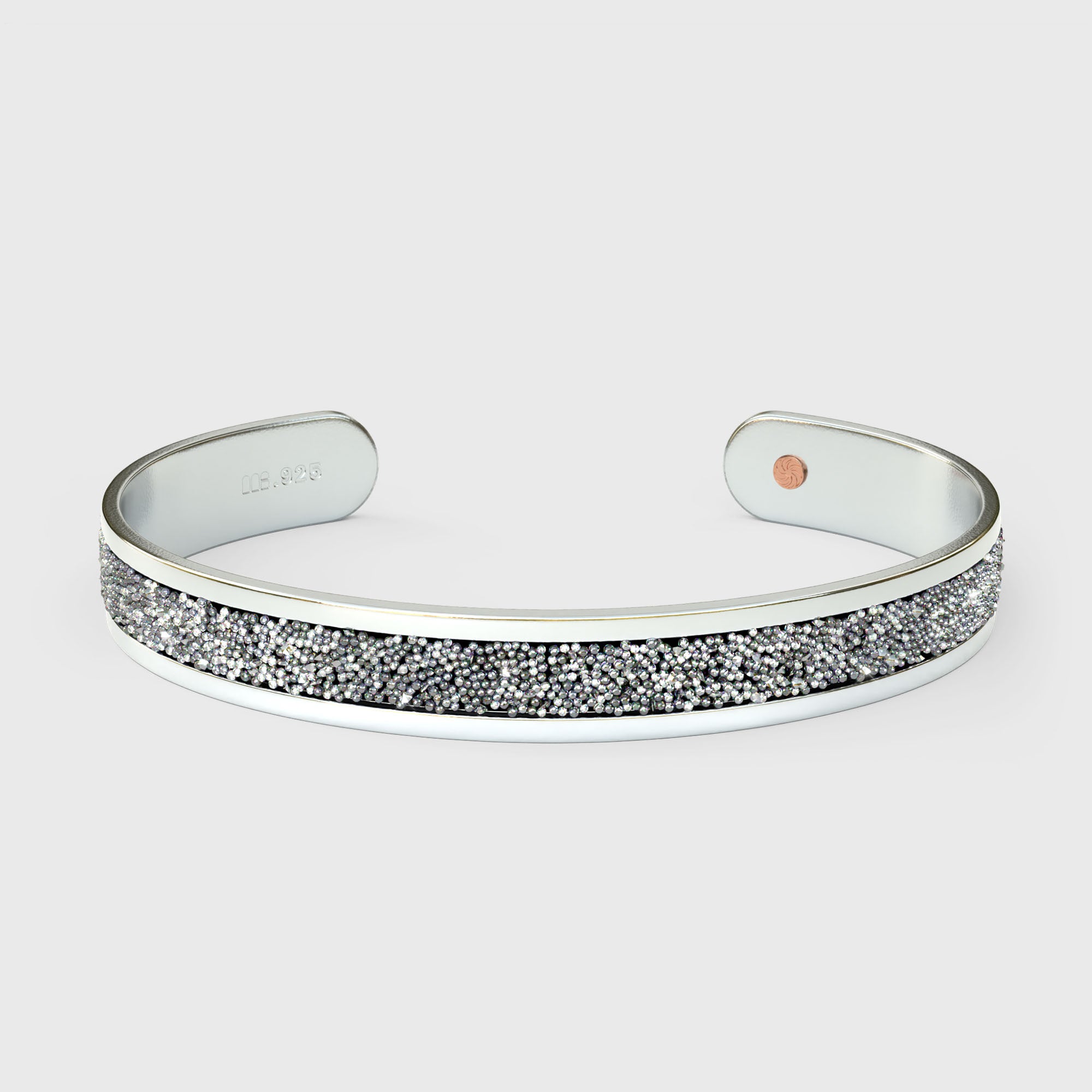 Close-up of SWAROVSKI® Chrome crystal fabric inlay on sterling silver cuff showing reflective shimmer and precise crystal texture