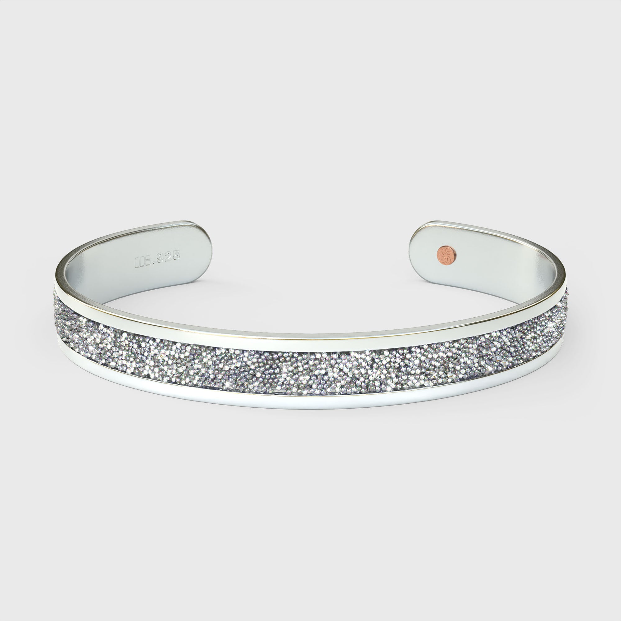 Close-up of SWAROVSKI® Diamond crystal fabric inlay on sterling silver cuff showing precision-cut sparkle and reflective brilliance